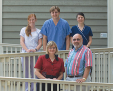 Barbara E Magera ACP Member in Charleston SC front row left chose to keep her solo internal medicine practice rather than integrate with a local hospital She stands with her husband Charle
