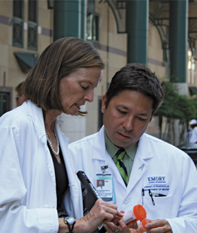 Ruth Parker FACP and Lorenzo DiFrancesco FACP members of the Emory  Grady Health Literacy Team in Atlanta examine pill bottle labels outside of Grady Hospital Photo courtesy of Kara L Jacobson MPH