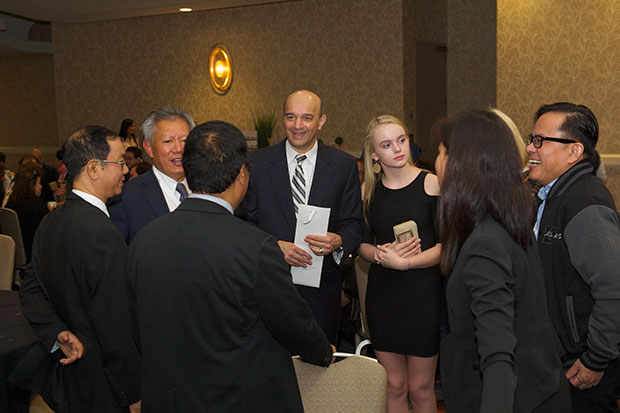 Nitin S Damle, MD, MS, MACP, outgoing president of ACP, greets members at the International Reception