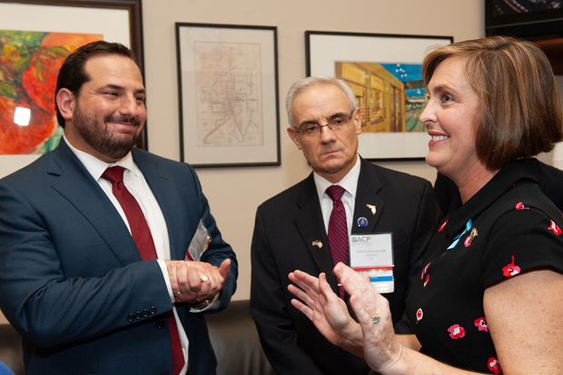 Jason M Goldman MD FACP left and Daniel S Bendetowicz MD FACP center appeal to Rep Kathy Castor D-FL during a brief standing meeting Photo by James Tkatch