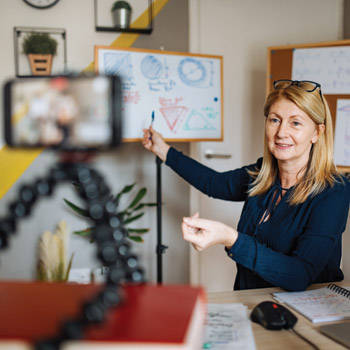 Among other tips for engaging an audience during a virtual lecture Give talks standing up instead of sitting in a chair Image by Drazen_